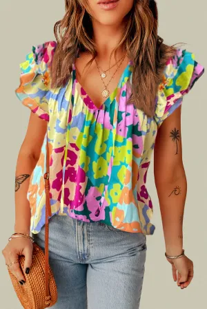 Ruffled Printed Tie Neck Cap Sleeve Blouse